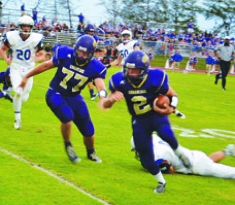 Tyler Patek gets past a defender as Dillon Kalina looks for another Flyer player to block.