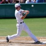A Johnson City batter takes a swing at a high pitch.